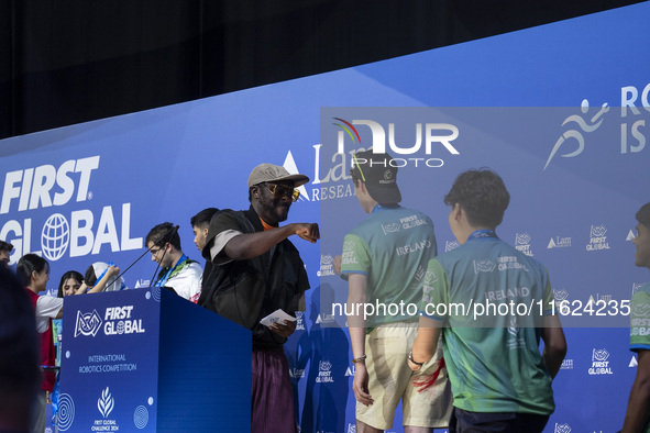 Will.i.am, frontman of the Black Eyed Peas, presents medals during the FIRST Global Challenge 2024, the ''Olympics'' of Robotics, in Athens,...