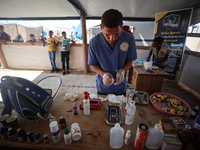 Veterinarians treat a cat at a newly opened clinic for animal care at a displacement camp in Deir el-Balah, Gaza Strip, on September 30, 202...