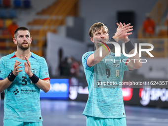 Jonathan Carlsbogard and Antonio Bazan Legasa of FC Barcelona after the 17th IHF Men's Club World Championship 2024 preliminary round match...