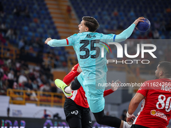 Domen Makuc of FC Barcelona tries to score during the 17th IHF Men's Club World Championship 2024 preliminary round match between Al Ahly Sp...