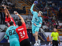 10 Abd Elrahman ABDOU of AL Ahly SC battles for the ball with 88 Petar CIKUSA JELICIC of FC Barcelona during the 17th IHF Men's Club World C...