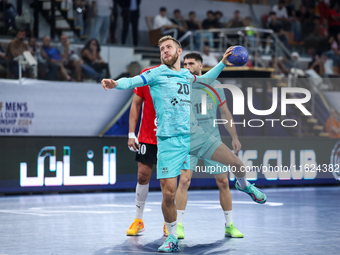 Aleix Gomez Abello of FC Barcelona tries to score during the 17th IHF Men's Club World Championship 2024 preliminary round match between Al...