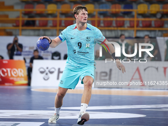 Jonathan Carlsbogard of FC Barcelona tries to score during the 17th IHF Men's Club World Championship 2024 preliminary round match between A...