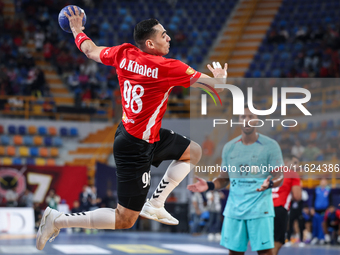 Omar Hassan of Al Ahly SC tries to score during the 17th IHF Men's Handball Club World Championship 2024 preliminary round match between Al...