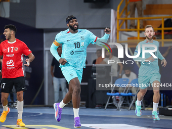 Dika Mem of FC Barcelona celebrates during the 17th IHF Men's Club World Championship 2024 preliminary round match between Al Ahly Sporting...