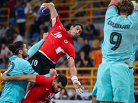 10 Abd Elrahman Abdou of Al Ahly SC battles for the ball with 82 Luis Diogo Da Sousa Frade of FC Barcelona during the 17th IHF Men's Club Wo...