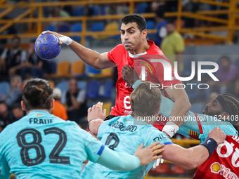 10 Abd Elrahman Abdou of Al Ahly SC battles for the ball with 10 Dika Mem of FC Barcelona during the 17th IHF Men's Club World Championship...