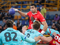 10 Abd Elrahman Abdou of Al Ahly SC battles for the ball with 10 Dika Mem of FC Barcelona during the 17th IHF Men's Club World Championship...