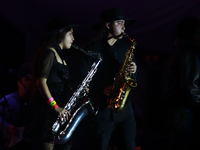 Members of the Orquesta Internacional band perform during the ''Hasta Siempre Presidente Fest'' at the Monumento to the Revolution in Mexico...