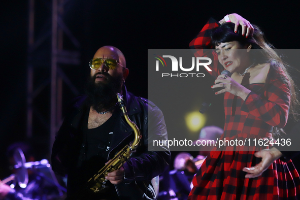 Members of the Orquesta Internacional band perform during the ''Hasta Siempre Presidente Fest'' at the Monumento to the Revolution in Mexico...