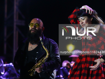 Members of the Orquesta Internacional band perform during the ''Hasta Siempre Presidente Fest'' at the Monumento to the Revolution in Mexico...