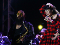 Members of the Orquesta Internacional band perform during the ''Hasta Siempre Presidente Fest'' at the Monumento to the Revolution in Mexico...