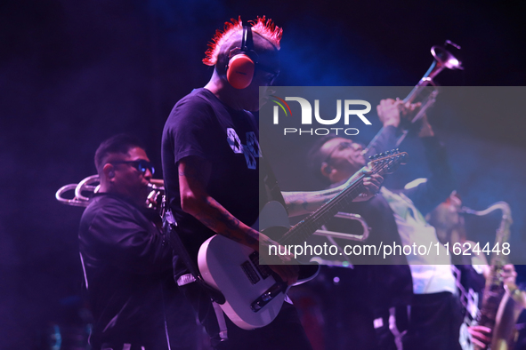 David Sanchez ''Chadou,'' guitarist of the Los Estramboticos band, performs during the ''Hasta Siempre Presidente Fest'' at the Monumento to...