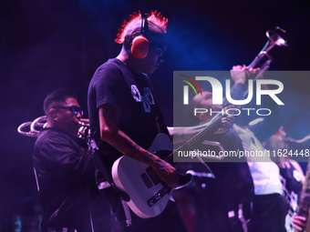 David Sanchez ''Chadou,'' guitarist of the Los Estramboticos band, performs during the ''Hasta Siempre Presidente Fest'' at the Monumento to...