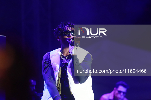 Rapper Erick Raul Aleman Ramirez, known as 'Aleman,' performs during the ''Hasta Siempre Presidente Fest'' at the Monumento to the Revolutio...