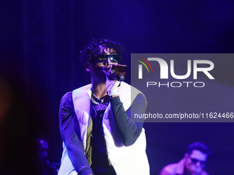 Rapper Erick Raul Aleman Ramirez, known as 'Aleman,' performs during the ''Hasta Siempre Presidente Fest'' at the Monumento to the Revolutio...