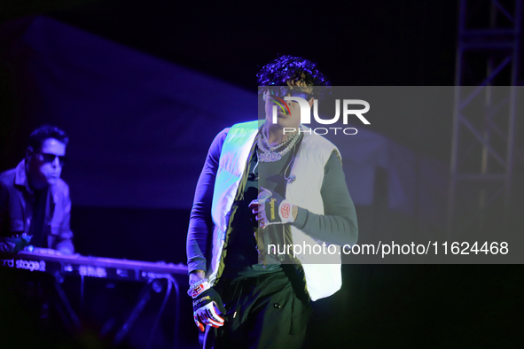 Rapper Erick Raul Aleman Ramirez, known as 'Aleman,' performs during the ''Hasta Siempre Presidente Fest'' at the Monumento to the Revolutio...