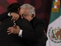 Andres Manuel Lopez Obrador, President of Mexico, gives his watch to a journalist during his last press conference at the National Palace in...