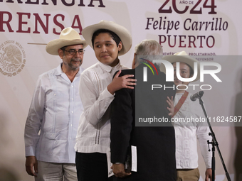 Andres Manuel Lopez Obrador, President of Mexico, says goodbye to the musical group Mono Blanco during his last press conference in Mexico C...