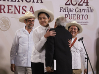 Andres Manuel Lopez Obrador, President of Mexico, says goodbye to the musical group Mono Blanco during his last press conference in Mexico C...