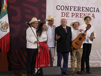 Andres Manuel Lopez Obrador, President of Mexico, says goodbye to the musical group Mono Blanco during his last press conference in Mexico C...