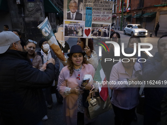 Supporters of Andres Manuel Lopez Obrador, President of Mexico, offer their support during his press conference in Mexico City, Mexico, on S...