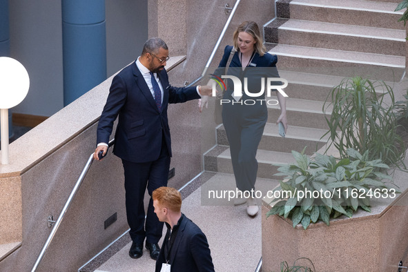 James Cleverly MP with his aides at the Conservative Party Conference at the International Conference Centre in Birmingham, United Kingdom,...