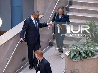 James Cleverly MP with his aides at the Conservative Party Conference at the International Conference Centre in Birmingham, United Kingdom,...