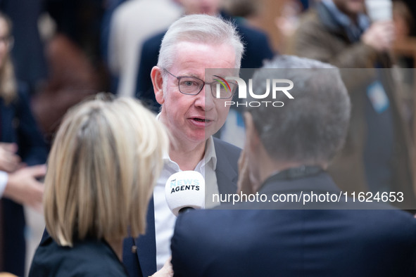 Michael Gove is interviewed by The News Agents' podcast's Emily Maitlis and Jon Sopel at the Conservative Party Conference at the Internatio...