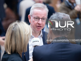 Michael Gove is interviewed by The News Agents' podcast's Emily Maitlis and Jon Sopel at the Conservative Party Conference at the Internatio...