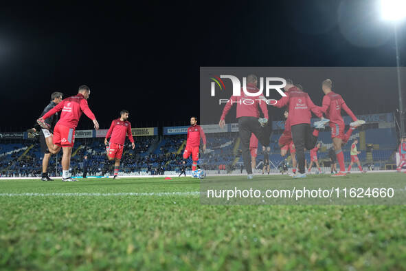 US Cremonese warms up for the Italian Serie B soccer championship match between Brescia Calcio FC and US Cremonese at Mario Rigamonti Stadiu...