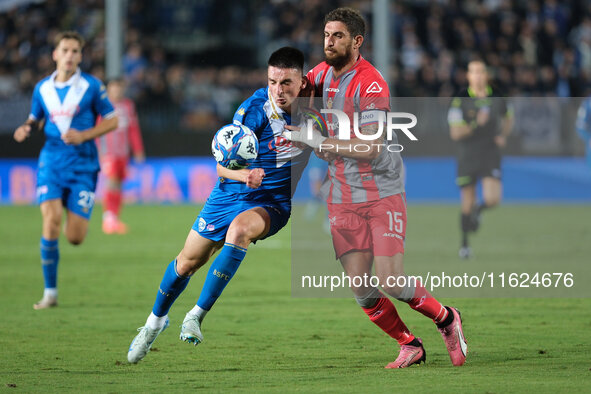 Ante Matteo Juric of Brescia Calcio FC contrasts with Matteo Biachetti of US Cremonese during the Italian Serie B soccer championship match...