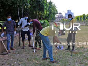 Workers use pesticides at a burrow to get rid of rats during a two-day campaign by Jaipur Development Authority to wipe out rodents at Alber...