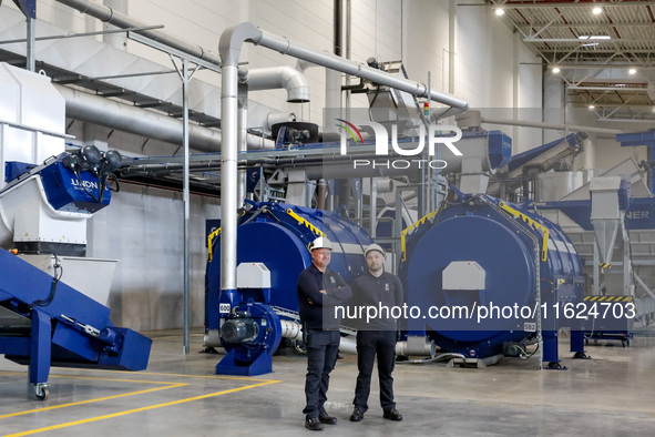 Men work in a newly opened plastic recycle plant in Krakow, Poland on September 30, 2024. The innovative plant will be able to recycle plast...