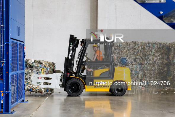 A man works in newly opened plastic recycle plant in Krakow, Poland on September 30, 2024. The innovative plant will be able to recycle plas...