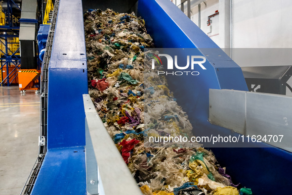 Plastic waste is seen on a production line in a newly opened plastic recycle plant in Krakow, Poland on September 30, 2024. The innovative p...