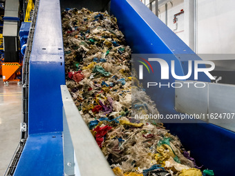 Plastic waste is seen on a production line in a newly opened plastic recycle plant in Krakow, Poland on September 30, 2024. The innovative p...