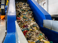 Plastic waste is seen on a production line in a newly opened plastic recycle plant in Krakow, Poland on September 30, 2024. The innovative p...