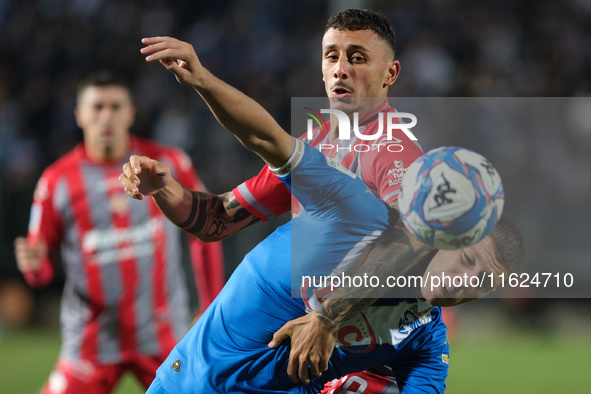 Michele Besaggio of Brescia Calcio FC contrasts with Michele Castagnetti of US Cremonese during the Italian Serie B soccer championship matc...