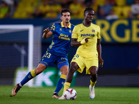 Thierno Barry of Villarreal CF competes for the ball with Alex Munoz of UD Las Palmas during the LaLiga EA Sports match between Villarreal C...