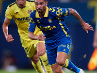 Benito Ramirez del Toro of UD Las Palmas competes for the ball with Ilias Akhomach of Villarreal CF during the LaLiga EA Sports match betwee...