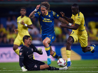 Fabio Daniel Soares Silva of UD Las Palmas competes for the ball with Eric Bailly and Diego Conde of Villarreal CF during the LaLiga EA Spor...