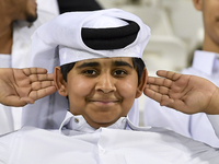 A fan of Al Sadd SC cheers for their team during the AFC Champions League elite west football match between Qatar's Al Sadd SC and Iran's Es...