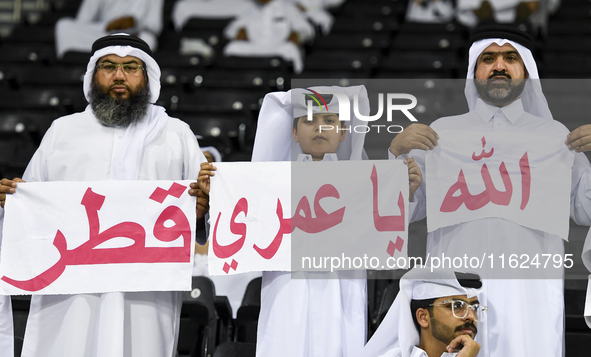 Fans of Al Sadd SC cheer for their team during the AFC Champions League elite west football match between Qatar's Al Sadd SC and Iran's Este...