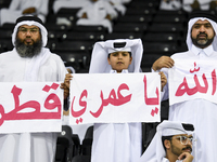 Fans of Al Sadd SC cheer for their team during the AFC Champions League elite west football match between Qatar's Al Sadd SC and Iran's Este...