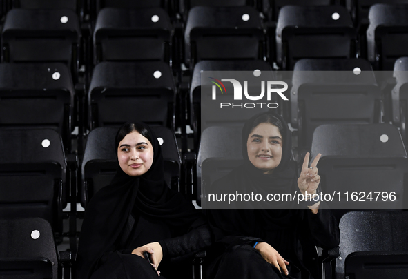 Fans of Esteghlal FC cheer for their team during the AFC Champions League elite west football match between Qatar's Al Sadd SC and Iran's Es...