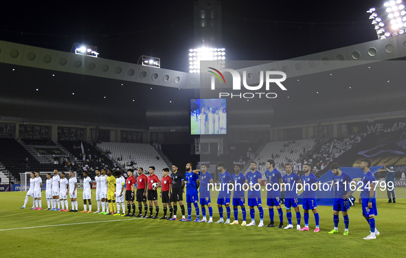 Esteghlal FC and Al Sadd SC players line up before the AFC Champions League elite west football match between Qatar's Al Sadd SC and Iran's...