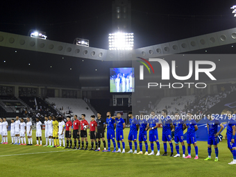 Esteghlal FC and Al Sadd SC players line up before the AFC Champions League elite west football match between Qatar's Al Sadd SC and Iran's...