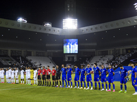 Esteghlal FC and Al Sadd SC players line up before the AFC Champions League elite west football match between Qatar's Al Sadd SC and Iran's...