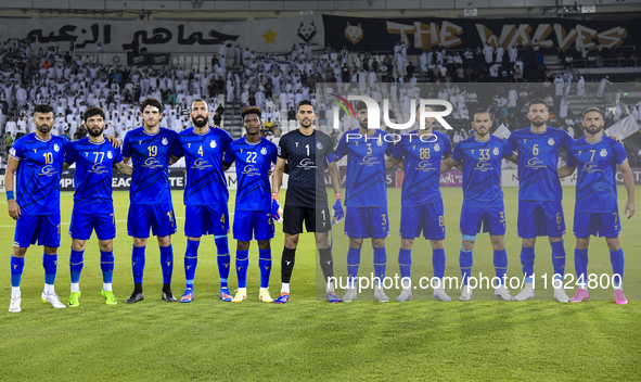 Esteghlal FC players line up before the AFC Champions League elite west football match between Qatar's Al Sadd SC and Iran's Esteghlal FC at...